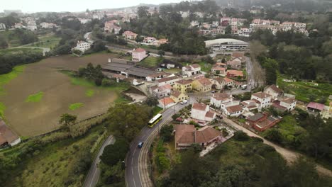Aerial-orbit-over-the-Monte-Santos-residential-area-near-Sintra,-Portugal-in-winter