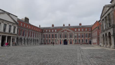 Panning-shot-of-Dublin's-Castle-square-with-tourists-in-Ireland