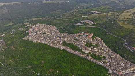 Ragusa-Italy-Aerial-v5-birds-eye-view-drone-flyover-and-around-hillside-Ibla-town-suited-on-the-hilly-terrain-capturing-charming-townscape-and-verdant-valleys---Shot-with-Mavic-3-Cine---June-2023