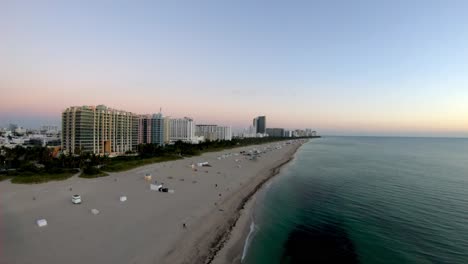 Aerial-Drone-footage-of-Miami-Beach-at-Sunrise-including-the-beach-front-and-the-buildings