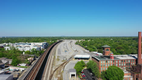 Industrial-terminal-for-trains,trucks-and-overpass-railroad-beside-factory-in-american-town