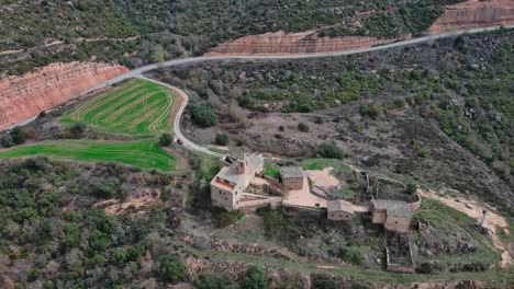 Tilt-up-view-of-Rialb-complex-and-viewpoint-with-surrounding-rural-landscape,-Lleida-in-Spain