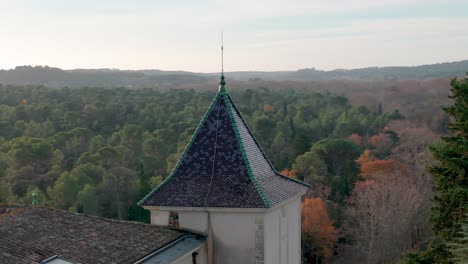 Aerial-orbiting-shot-of-a-spire-on-the-Departmental-area-of-Restinclieres