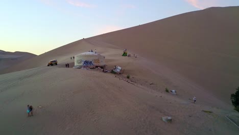 People-Gathering-at-a-Sand-Dune-Overlooking-Huacachina-Oasis
