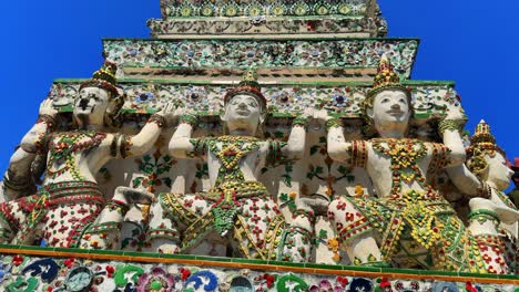 Wat-Arun-Temple-of-dawn-beautiful-carved-colorful-statues-buddhist-religion