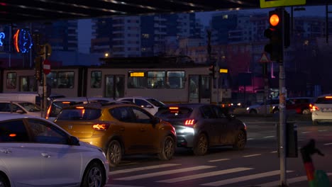 Cars-Stopped-On-Crosswalk-And-Trams-Crossing-Intersection