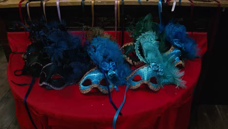 Feathered-azure-masks-on-display,-Ca'-Macana-Venice
