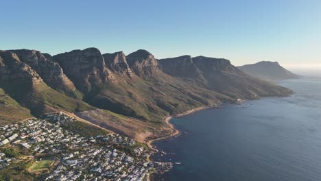 Sunset-Aerial-View-of-Twelve-Apostles-Mountains-over-Cape-Town-and-Camps-Bay,-South-Africa
