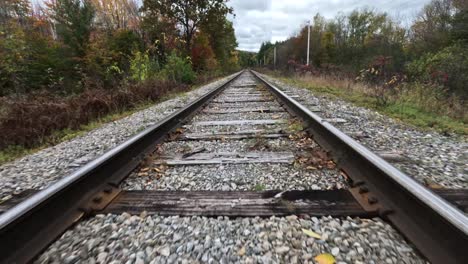 New-Hampshire-Railroad-During-Fall-Colors,-FPV-Aerial-Shot