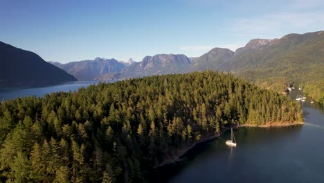 Sailboat-in-the-mountains-of-Canada-in-Desolation-Sound,-Canada