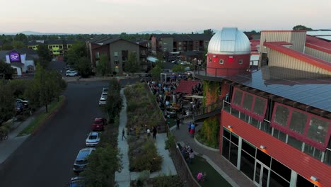 Drone-shot-of-the-Worthy-Brewing-company's-busy-beer-garden-during-a-summer-sunset