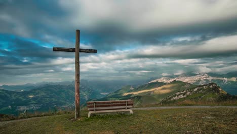 Timelapse-in-the-front-of-a-cross-at-the-mountain-Ebenalp-in-Switzerland