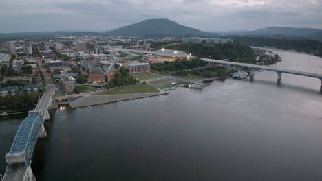 Aerial-hyperlapse-during-sunset-that-shows-the-Tennessee-Aquarium,-the-Tennessee-River-and-Lookout-Mountain