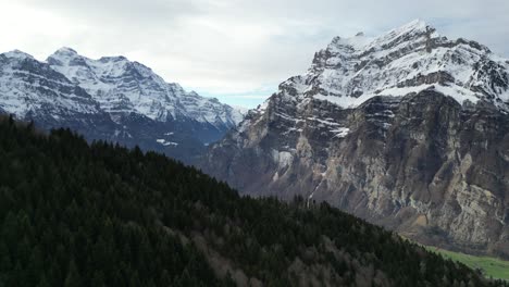 Breathtaking-Aerial-shot-of-Mountain-Peaks-in-Fronalpstock-Glarus-Switzerland