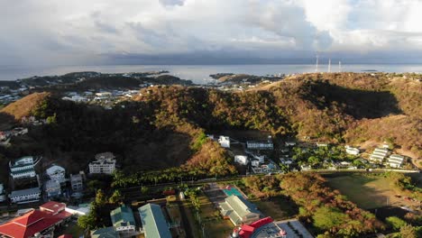 Houses-in-sea-bay-on-tropical-island-of-Grenada,-aerial-establisher