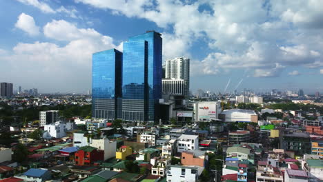 Aerial-tracking-shot-in-front-of-the-Ayala-Malls-Circuit,-in-Makati,-Philippines