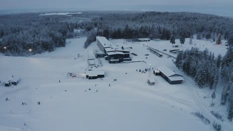 Drone-shot-of-a-ski-resort-in-Lapland,-country-of-Santa-Claus-in-Suomutunturi,-Finland