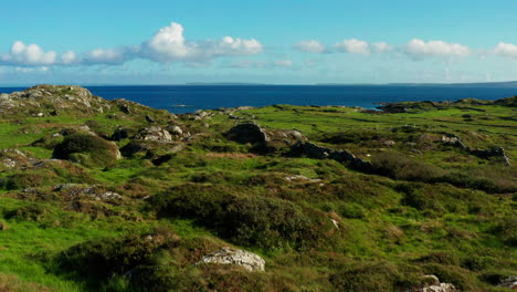 Explore-the-captivating-charm-of-Connemara,-Galway,-Ireland,-with-a-mesmerizing-push-drone-shot-unveiling-the-lush-green-landscape-that-defines-its-unparalleled-beauty