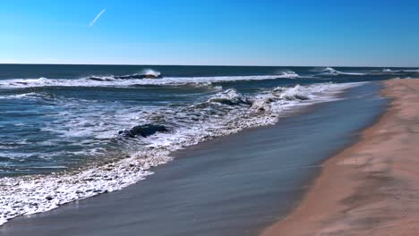A-low-angle-perspective-of-an-empty-beach-on-a-sunny-day
