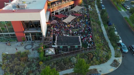 Rising-drone-shot-over-the-Worthy-Brewing-Company-outdoor-concert-series