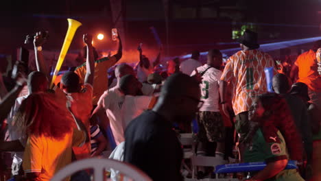 Ivorian-Fans-Joyfully-Jumping-And-Celebrating-After-Ivory-Coast-Win,-Africa-Cup-of-Nations-2023,-Abidjan