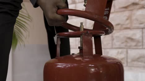 Liquefied-Petroleum-Gas-cylinder-refilling-and-gas-leakage-through-valve-close-up-at-day