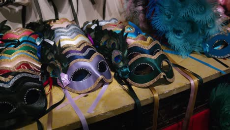 Colorful-ribboned-masks-at-Ca'-Macana,-Venice---close-up