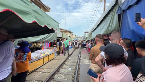 Maeklong-Railway-Market-Talad-Rom-Hub-preparation-before-train-passing