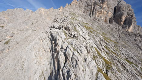 Rocky-mountains-of-Dolomites-in-Italy,-aerial-FPV-fly-view