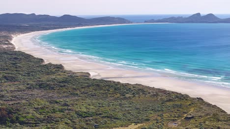 Beautiful-wide-aerial-of-Mason-Bay-in-Stewart-Island,-New-Zealand