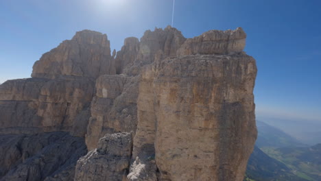 Rocky-Dolomite-mountains-on-sunny-day,-aerial-FPV-view