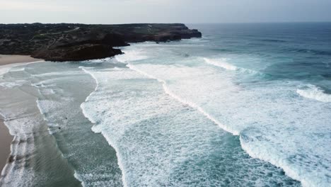 Drone-shot-of-waves-crashing-into-rocks