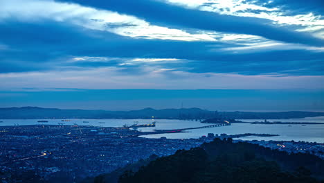 Evening-to-night-timelapse-of-Berkeley-city-in-Northern-California-and-San-Francisco-Bay-California,-USA