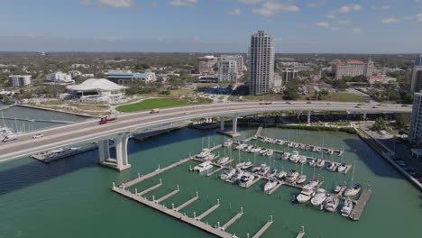Drone-flight-over-Downtown-Clearwater-Causeway-Byway-Bridge-overlooking-Coachman-Park,-and-marina