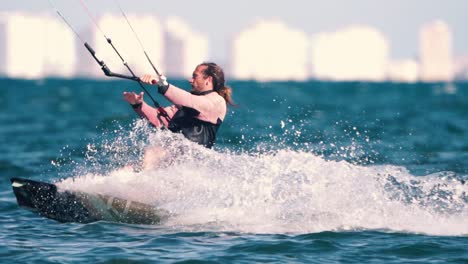 Los-Alcazares,-Spain,-May-3,-2023:-Sportsman-practicing-kite-surf-sport-at-the-beach-on-a-windy-day-at-the-Spanish-coasts