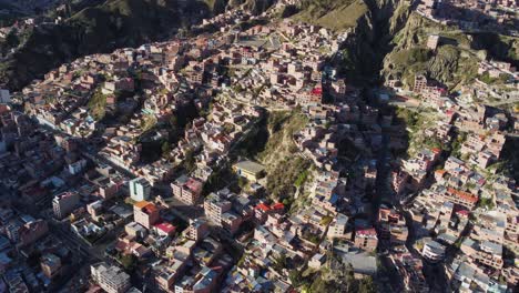 Aerial:-Buildings-in-La-Paz-Bolivia-on-steep-rocky-mountain-slopes