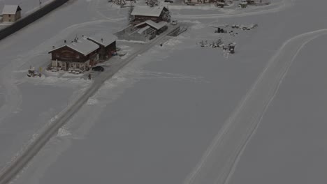 Stunning-Livigno-Alps-drone-video:-snow-peaks,-city-and-mountain-town,-ideal-for-high-quality-winter-and-tourism-ads