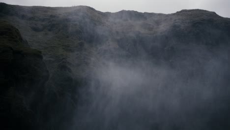 Spooky-mist-rises-amidst-cool-green-cliffs-setting-a-scary-and-ominous-atmosphere