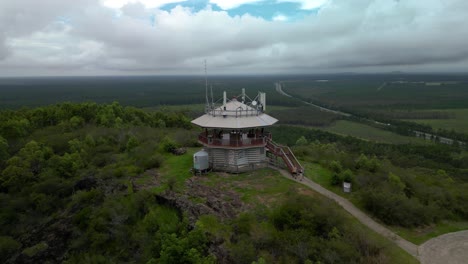 Panoramic-drone-view-of-the-Wild-Horse-Mountain-scenic-lookout-and-fire-tower-with-views-of-the-Glass-House-Mountain-Range