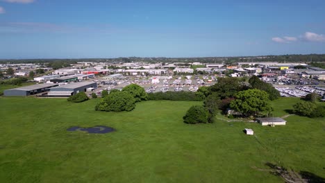 Right-to-left-aerial-views-over-the-industrial-area-and-green-space-in-Brendale