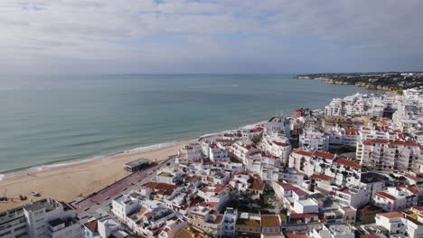 White-Apartment-Buildings-Beside-Armacao-De-Pera-Beach-In-Portugal