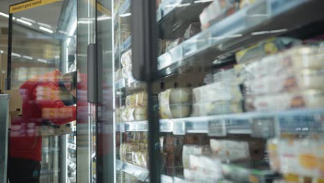 Closeup-shot-of-an-employee-keeping-things-inside-at-a-French-supermarket