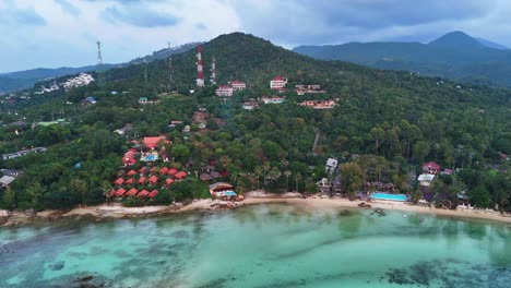 Panoramic-aerial-view-of-tropical-island-with-luxury-resort