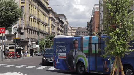 Busy-Italian-city-street-scene-daily-commuting-on-public-bus,-car-and-foot