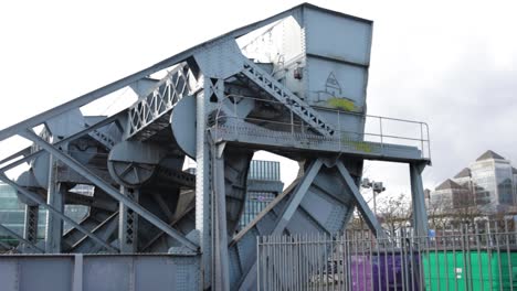 A-close-up-shot-of-the-metal-structure-of-a-Scherzer-rolling-lift-bridge-in-the-North-Wall-Quay-in-Dublin,-Ireland