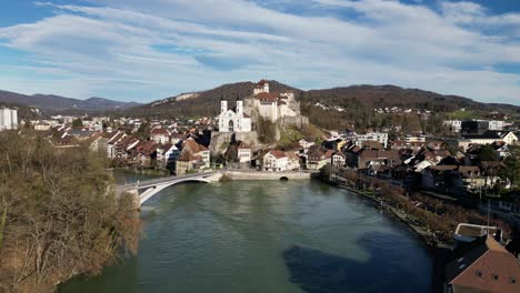 Aarburg-Aargau-Switzerland-swirling-river-in-front-of-castle-slow-approach-flight