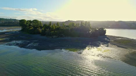 Aerial-Drone-Sunrise-Landscape,-Natural-Aucar-Island-in-Chiloé-Chilean-Patagonia