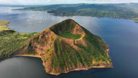 Aerial-approaching-shot-of-famous-taal-volcano-at-taal-lake-in-Philippines,-Batangas-Province,-South-Manila,Tagaytay-village