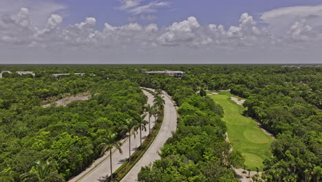 Akumal-Mexico-Aerial-v10-cinematic-flyover-Riviera-Maya-golf-course-capturing-beautiful-landcape-of-lush-fairways-surrounded-by-natural-Mayan-jungle-in-summer---Shot-with-Mavic-3-Pro-Cine---July-2023