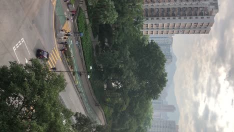 Vertical-footage-of-a-busy-crossing-in-Tai-Po,-Hong-Kong
